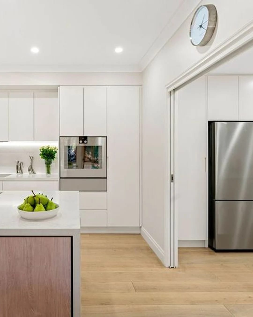 Light and airy modern kitchen featuring HW12342 Maison.
